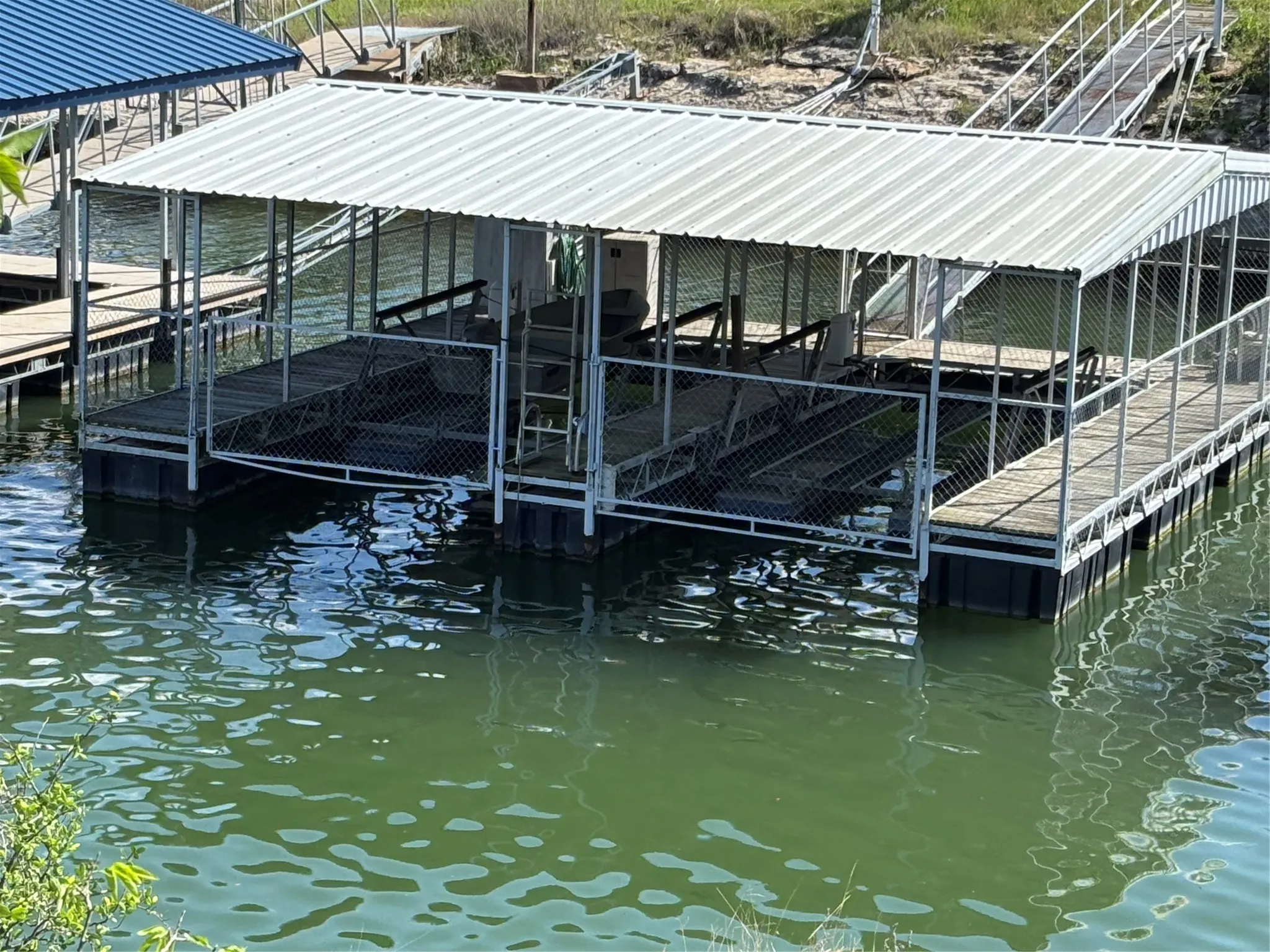 1ST OPTION TO PURCHASE goes to home buyer. slips boathouse with 2 pneumatic l
boat lifts. Located just down from house
