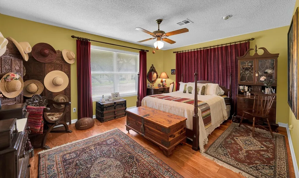 Bedroom elegantly finished with handscrapped hardwood flooring