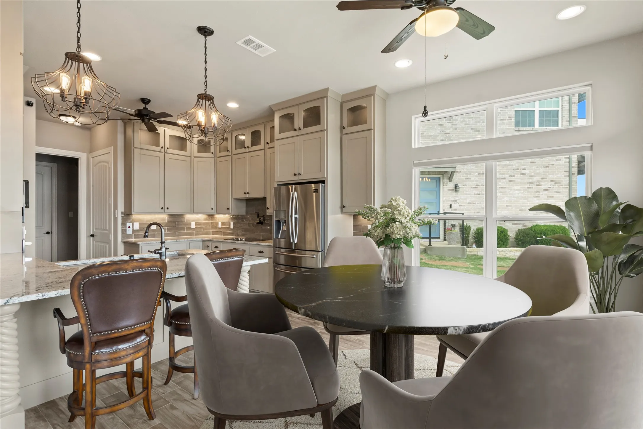 Staged Photo* Dining area and kitchen bar seating.
