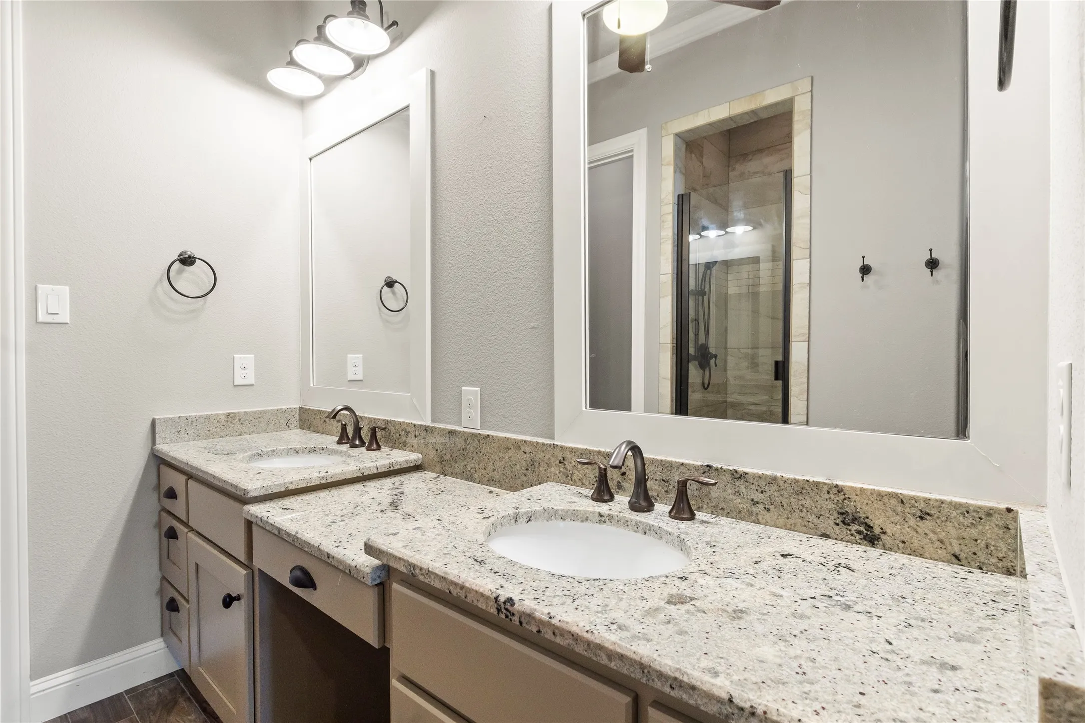 Double sink vanity with make up vanity and granite counter tops