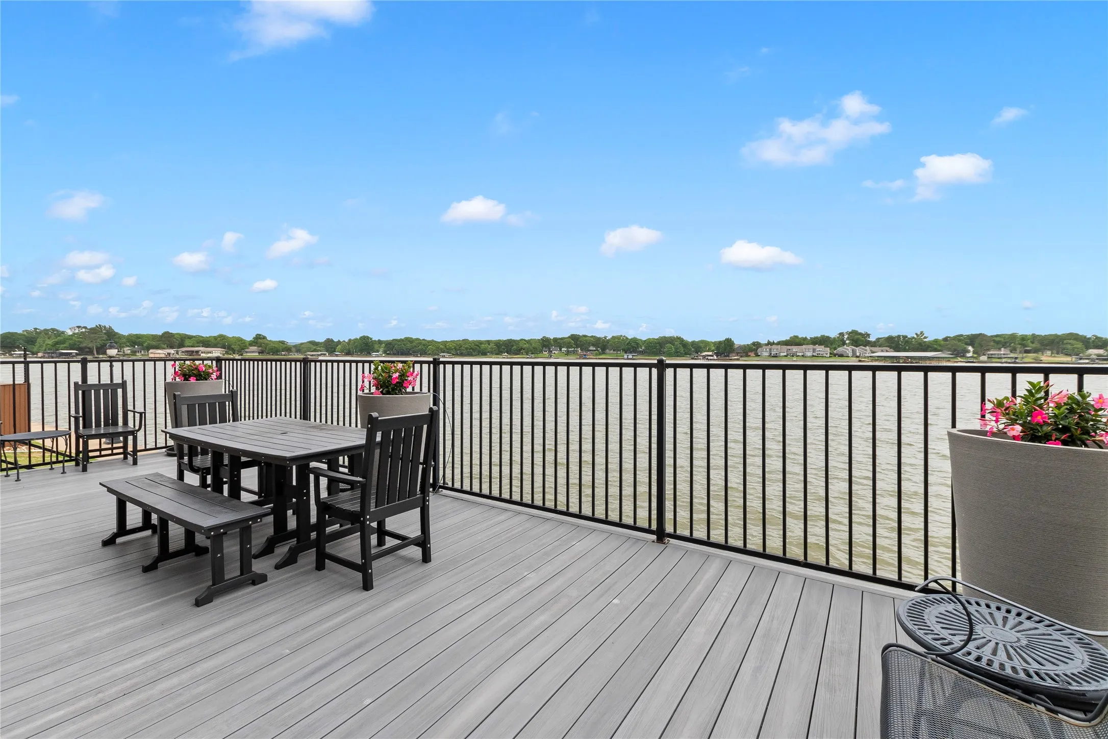 Spacious and durable composite deck faces east with protection from afternoon west sun. Experience southerly breezes while enjoying a cup of coffee in the morning or your favorite evening beverage.
