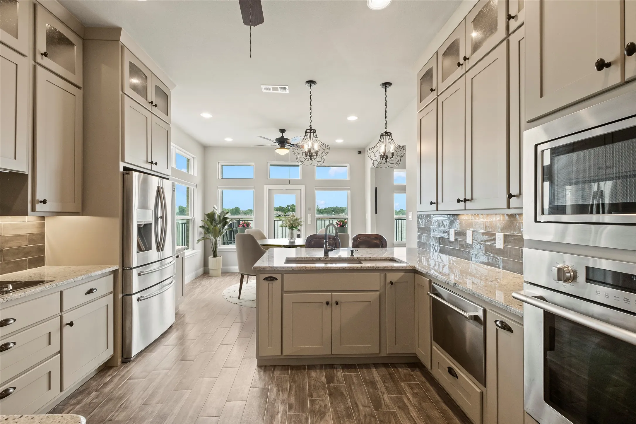Staged Photo* Stainless steel built in oven, microwave and drawer dishwasher.