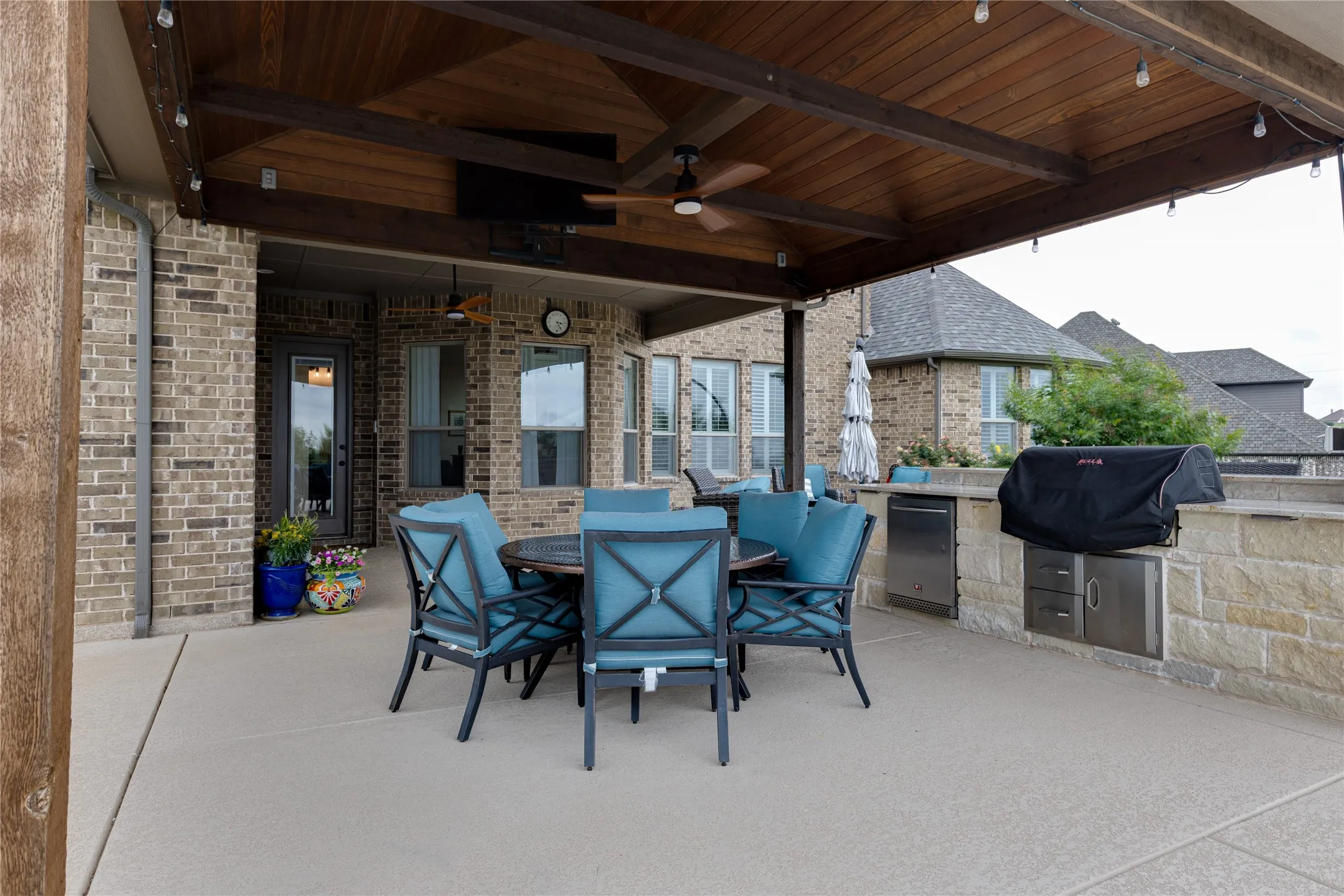 Extended Patio and Outdoor Kitchen with misters, ceiling fans & TV
