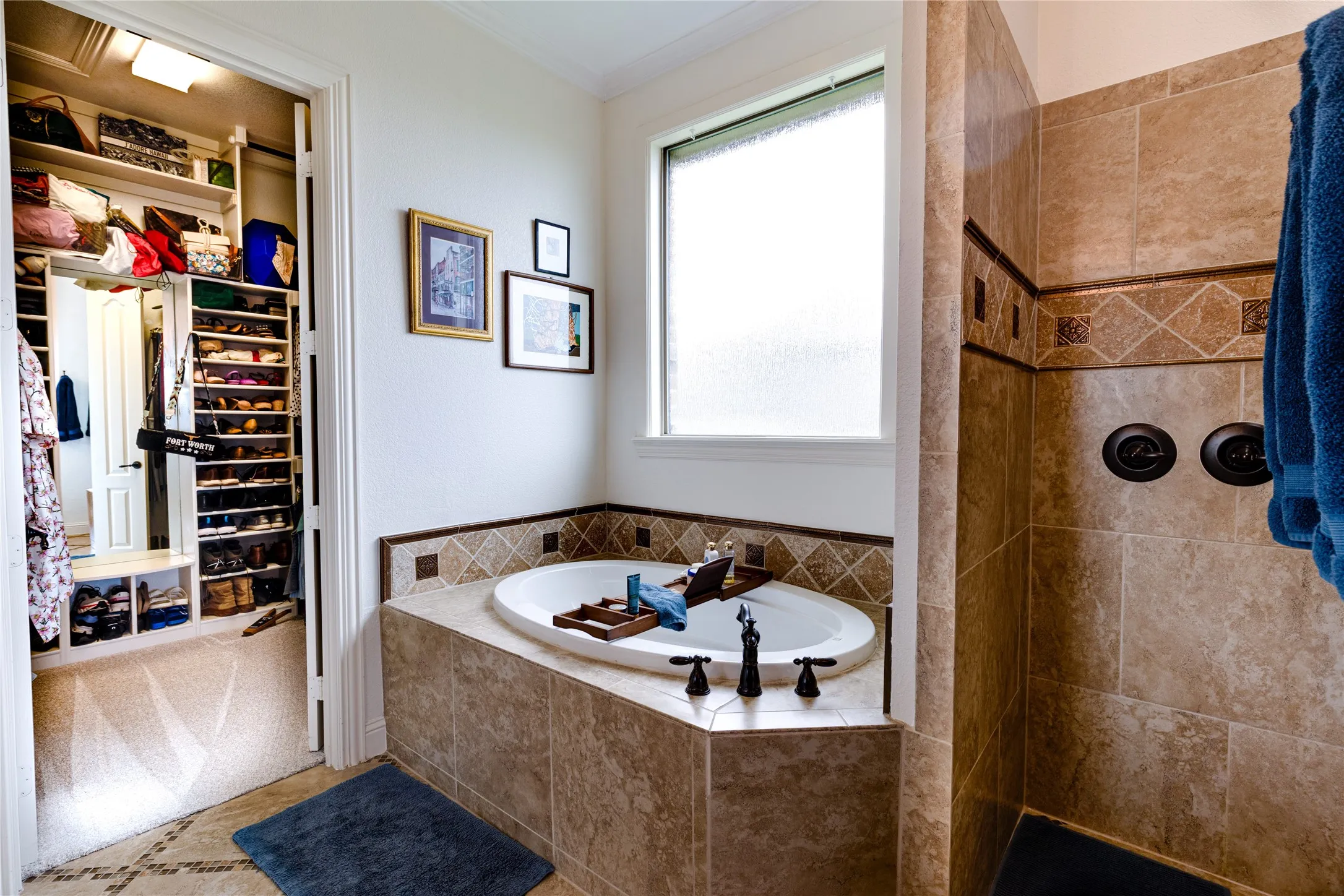 Primary bathroom with soaking tub, walk in shower with rain heads