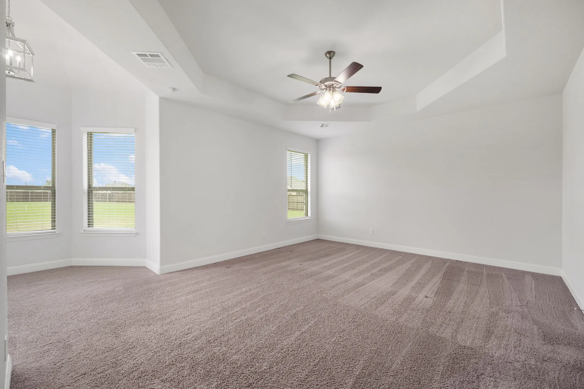 Large primary bed with sitting area