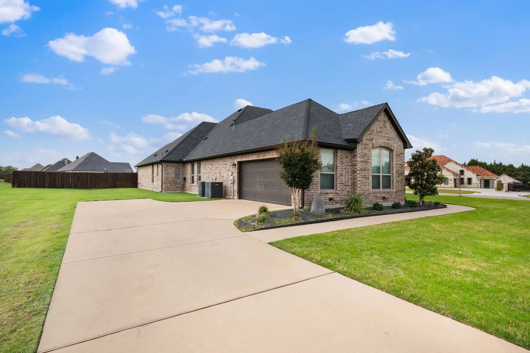 Driveway with side entry garage and space to expand