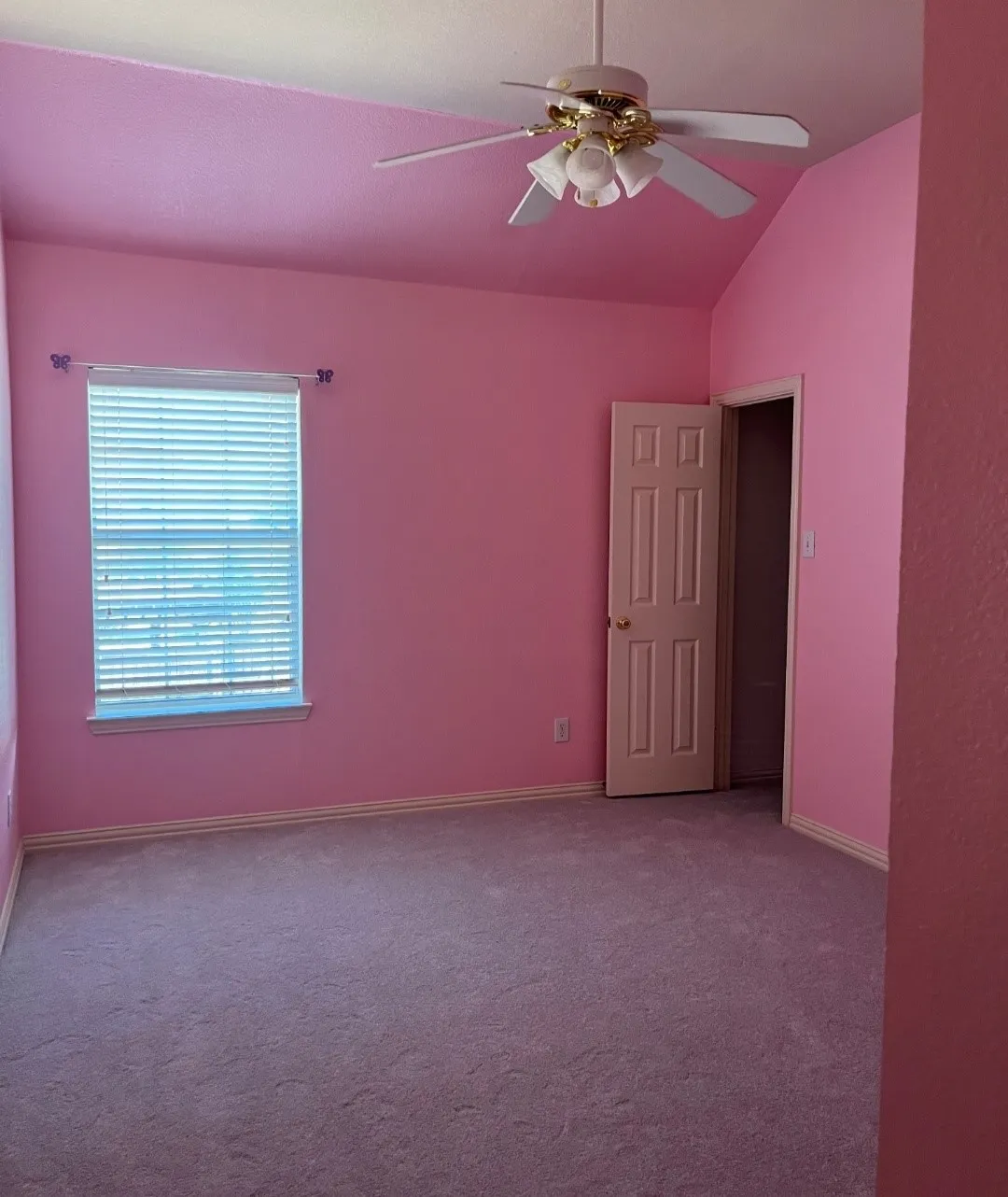 Room featuring vaulted ceilings and a ceiling fan with integrated lighting