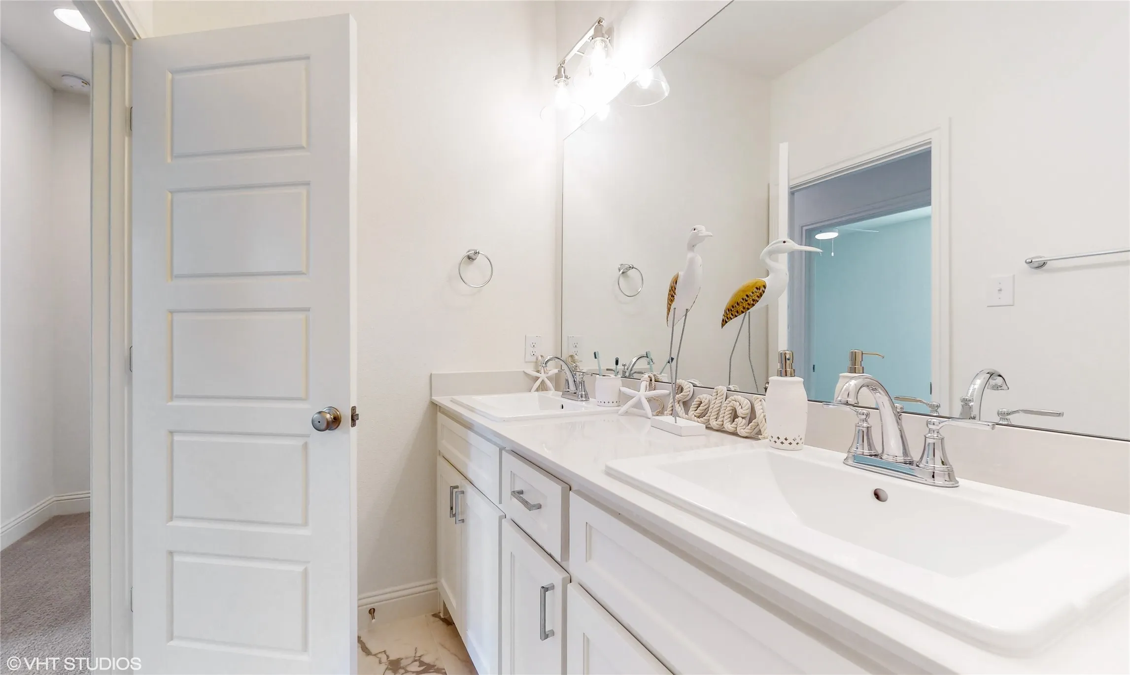 Two sinks and separate water closest/shower room in shared bath upstairs. Sinks will be undercount, not drop in as depicted in rendering.