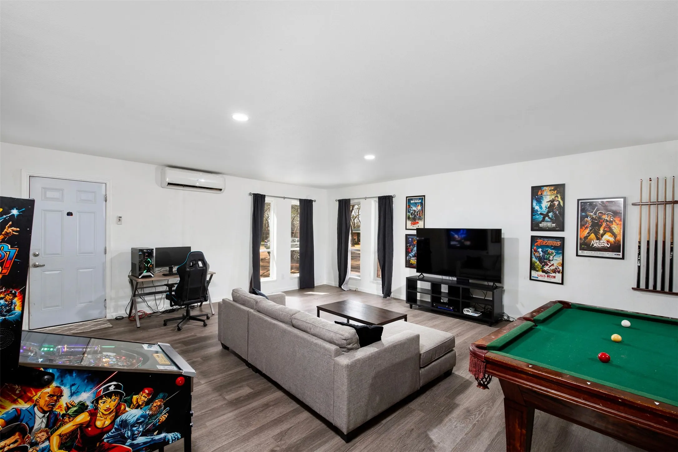 5TH BEDROOM - 3RD LIVING ROOM: Digitally staged as a game room for this photo.