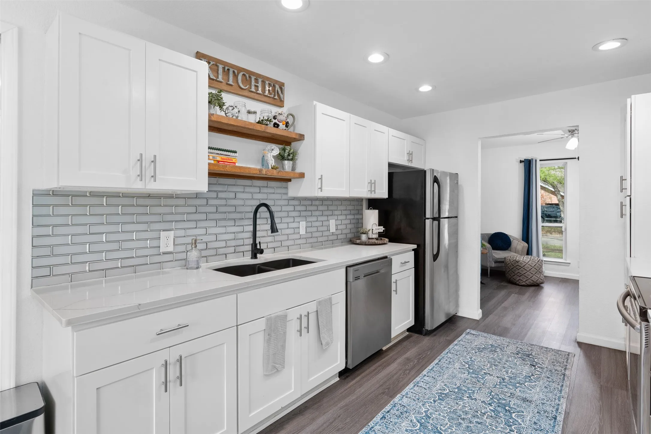 Recently updated with quartz counters and sleek tile backsplash!