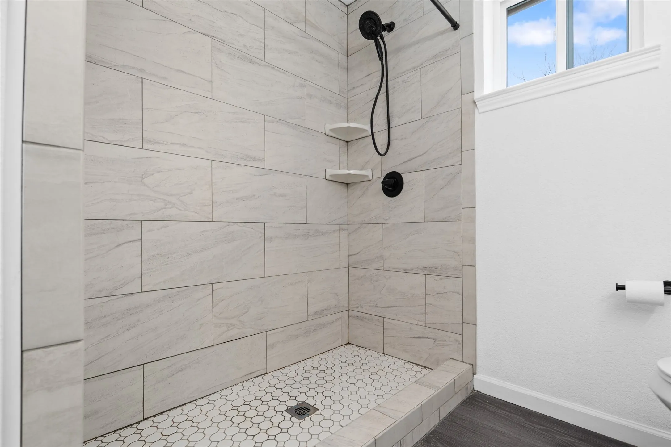 Brand new primary shower with gorgeous tiles!