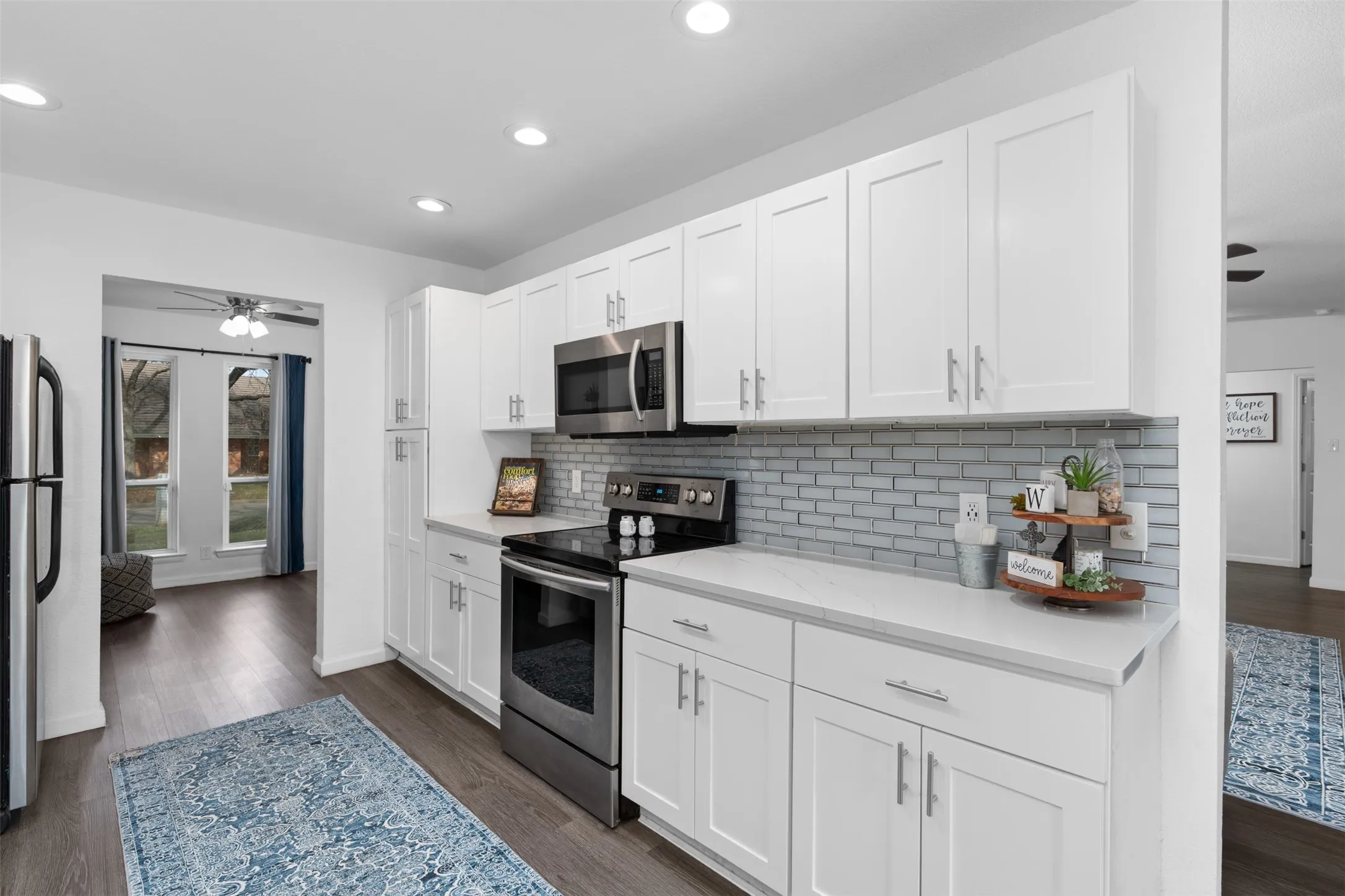 Recently updated with quartz counters and sleek tile backsplash!