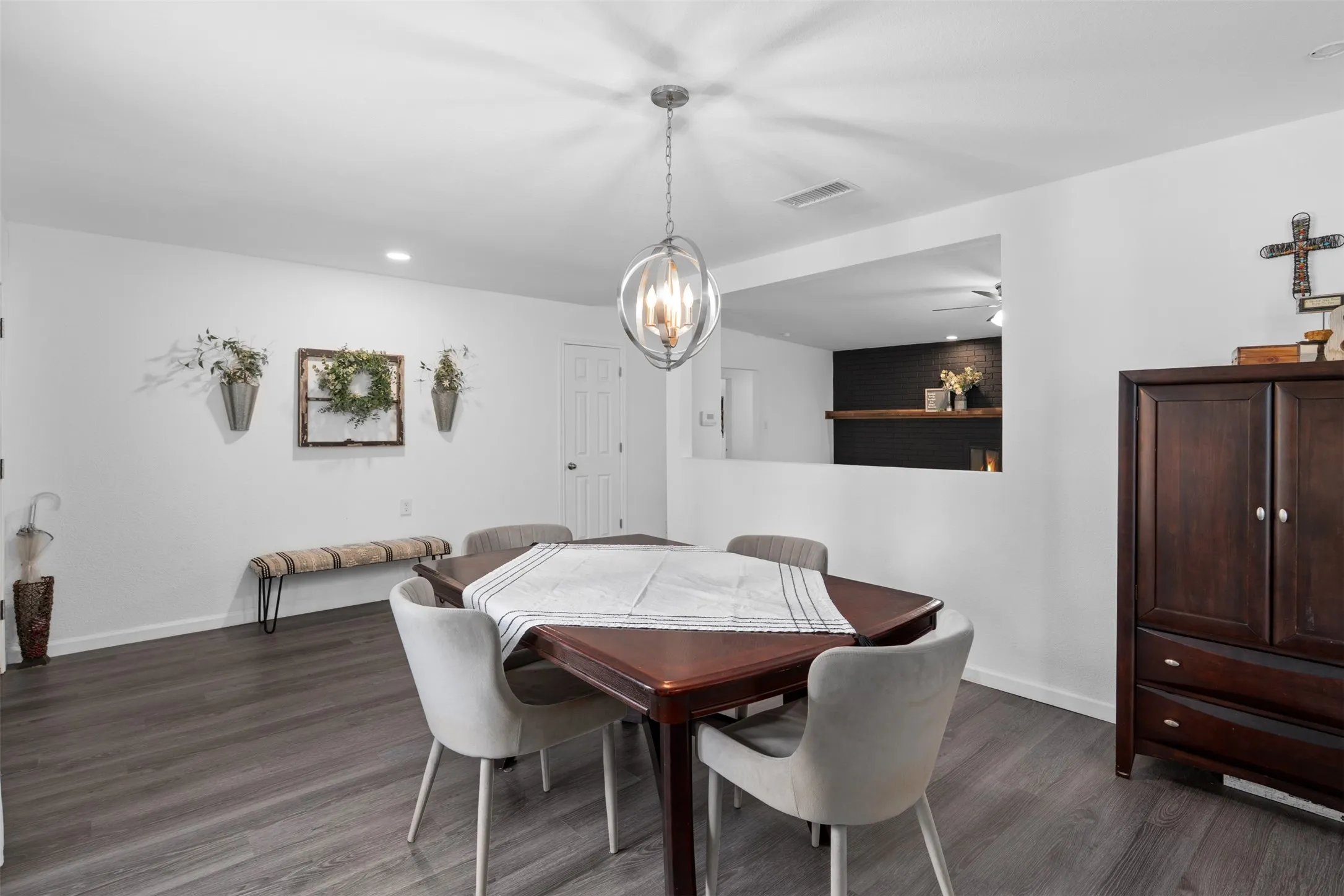 This area just inside the entry is currently being used as a large formal dining space, but could also function as a formal living space or sitting area.