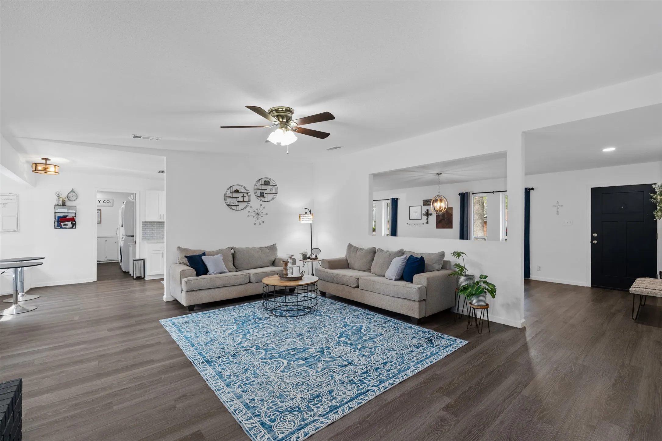 Oversized family room is open to the kitchen and the formal living space.