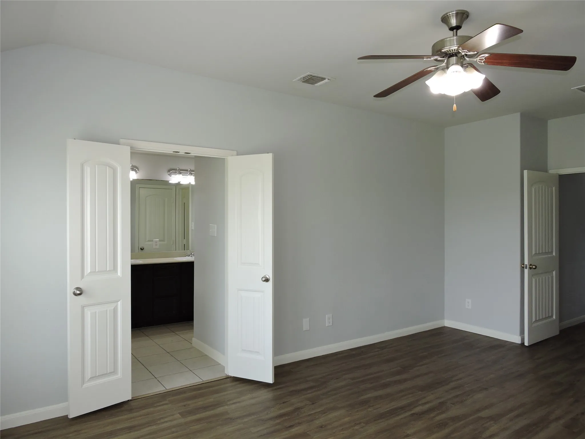 This room features wood-look flooring and light gray walls