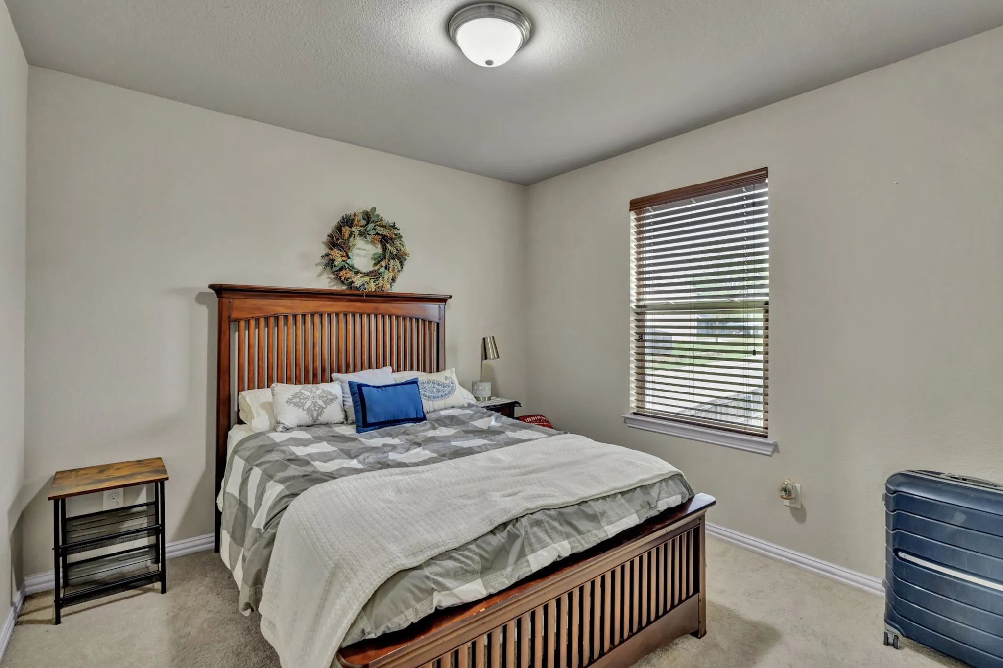 This room features light-colored walls and carpeted flooring