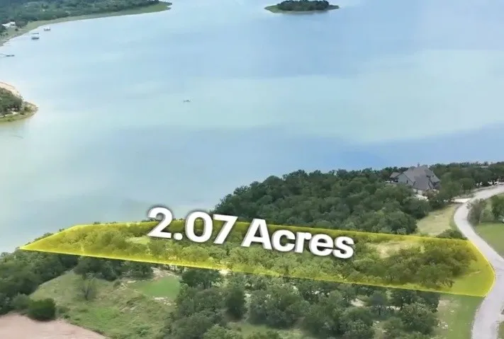 Expansive 2.07-acre parcel featuring significant waterfront access and a natural tree line