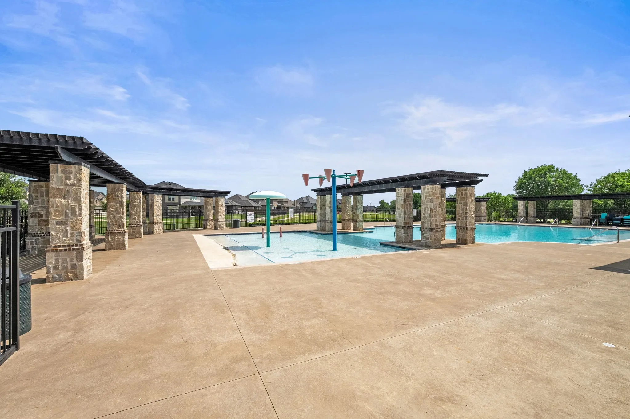 Neighborhood pool with splashpad area.