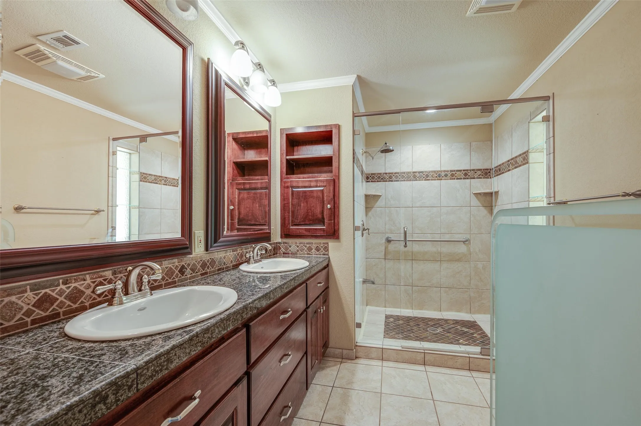 Large shower in updated primary bathroom.