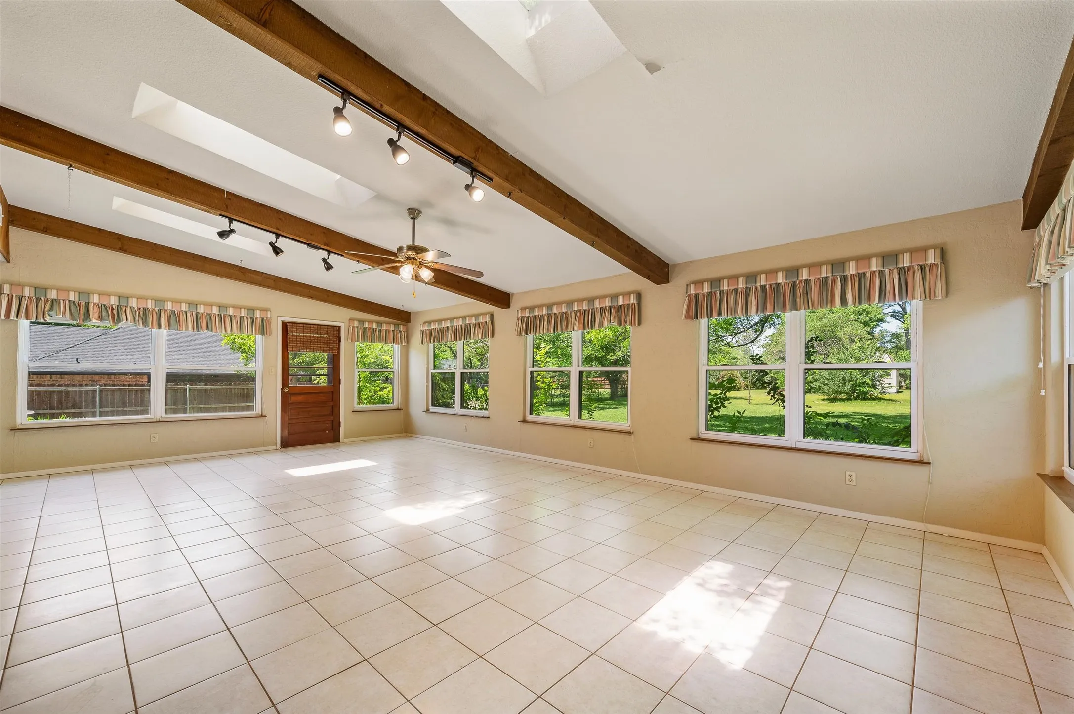 3 skylights and wrap around windows add beautiful natural light to this space.