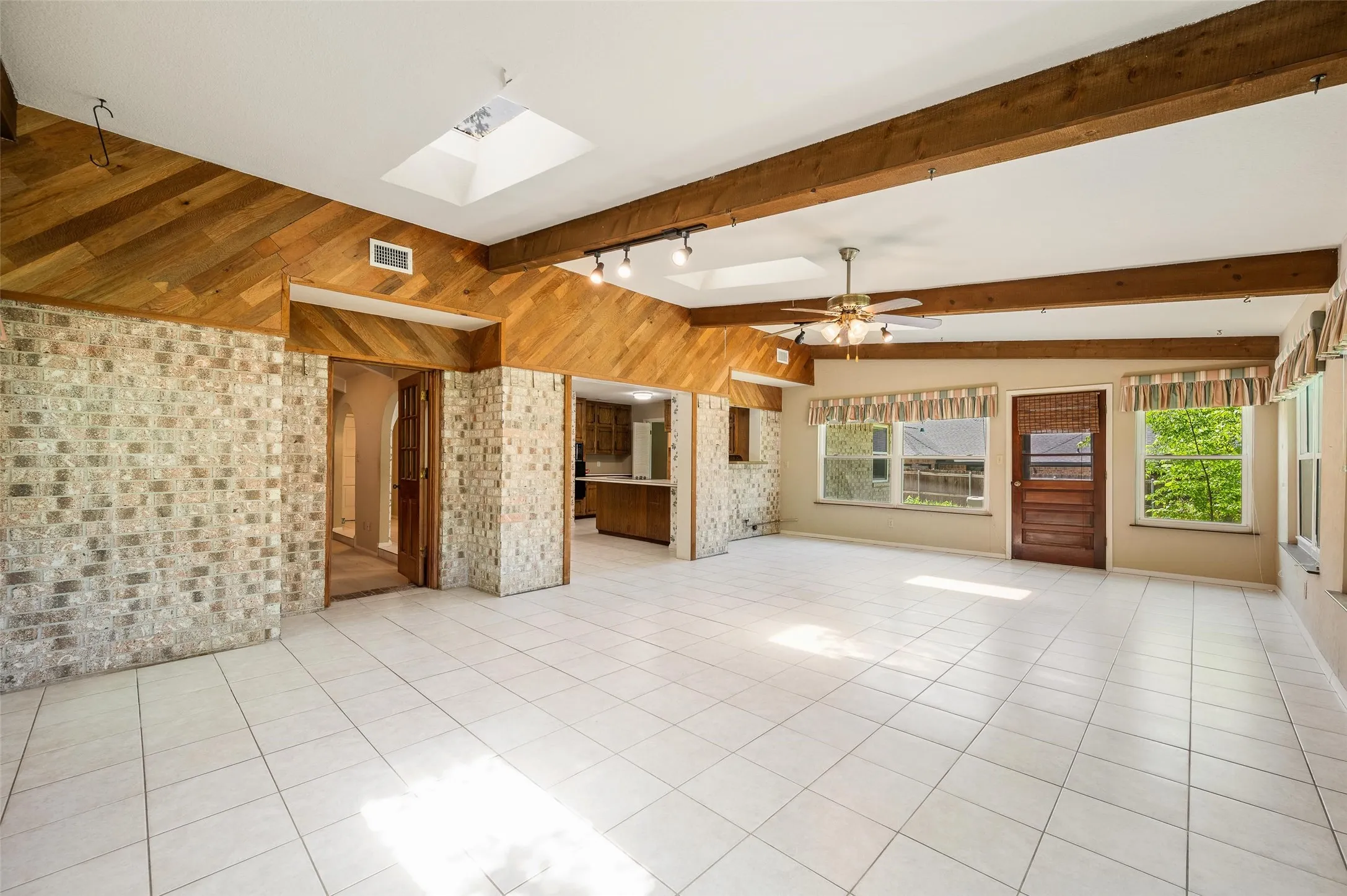 Striking brick accent wall with wood detail.