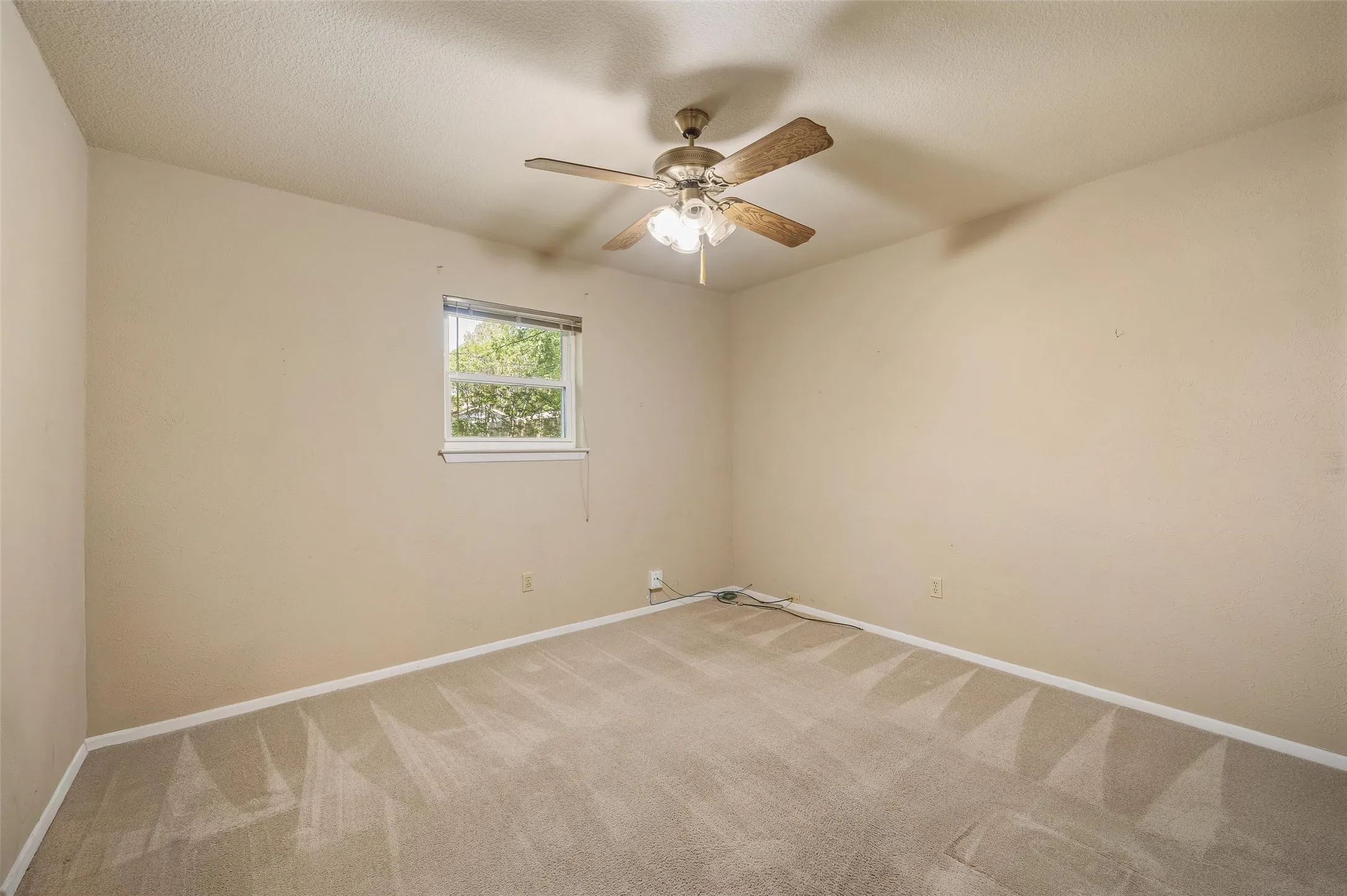 2nd bedroom looks out to backyard.