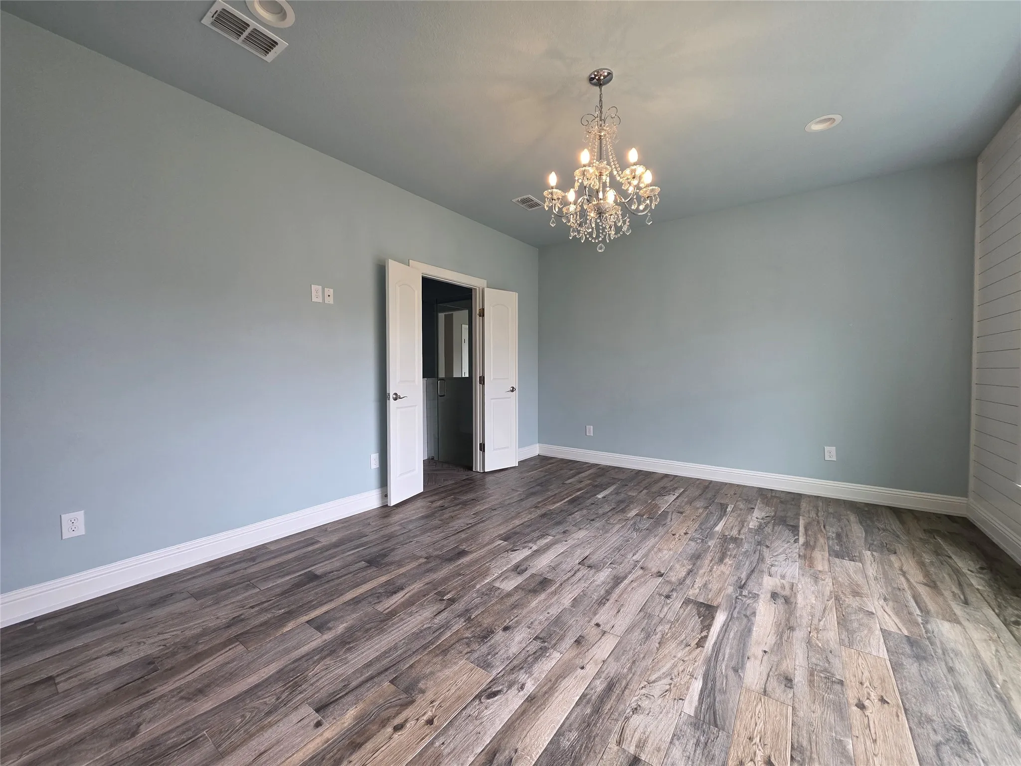 Robin egg blue walls with a chandelier