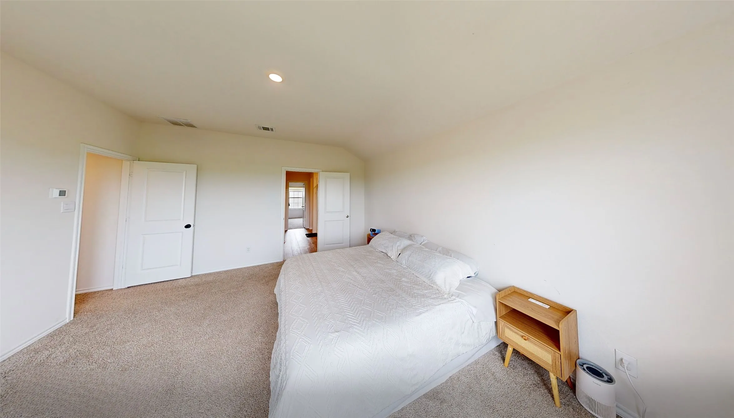 Carpeted room with recessed lighting, white walls, and white panel doors