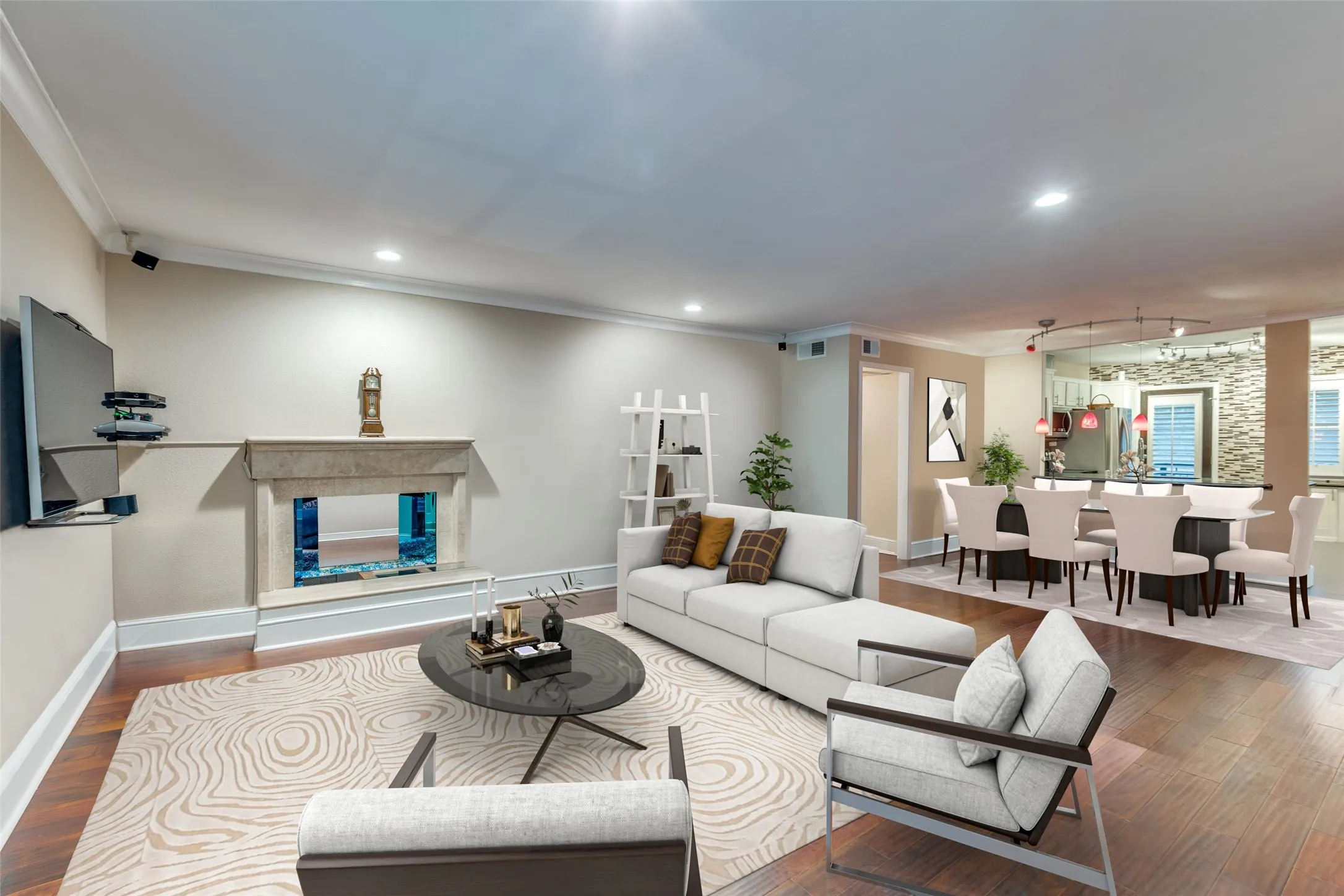 Living room with ornamental molding, hardwood / wood-style flooring, and rail lighting tastefully reimagined with virtual staging!
