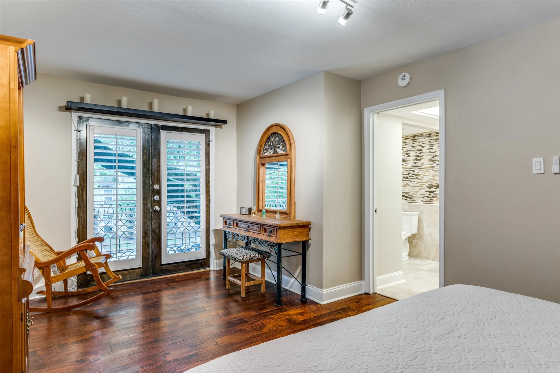 Primary bedroom has additional nice niche for sitting or enjoying the view through the second set of french doors.