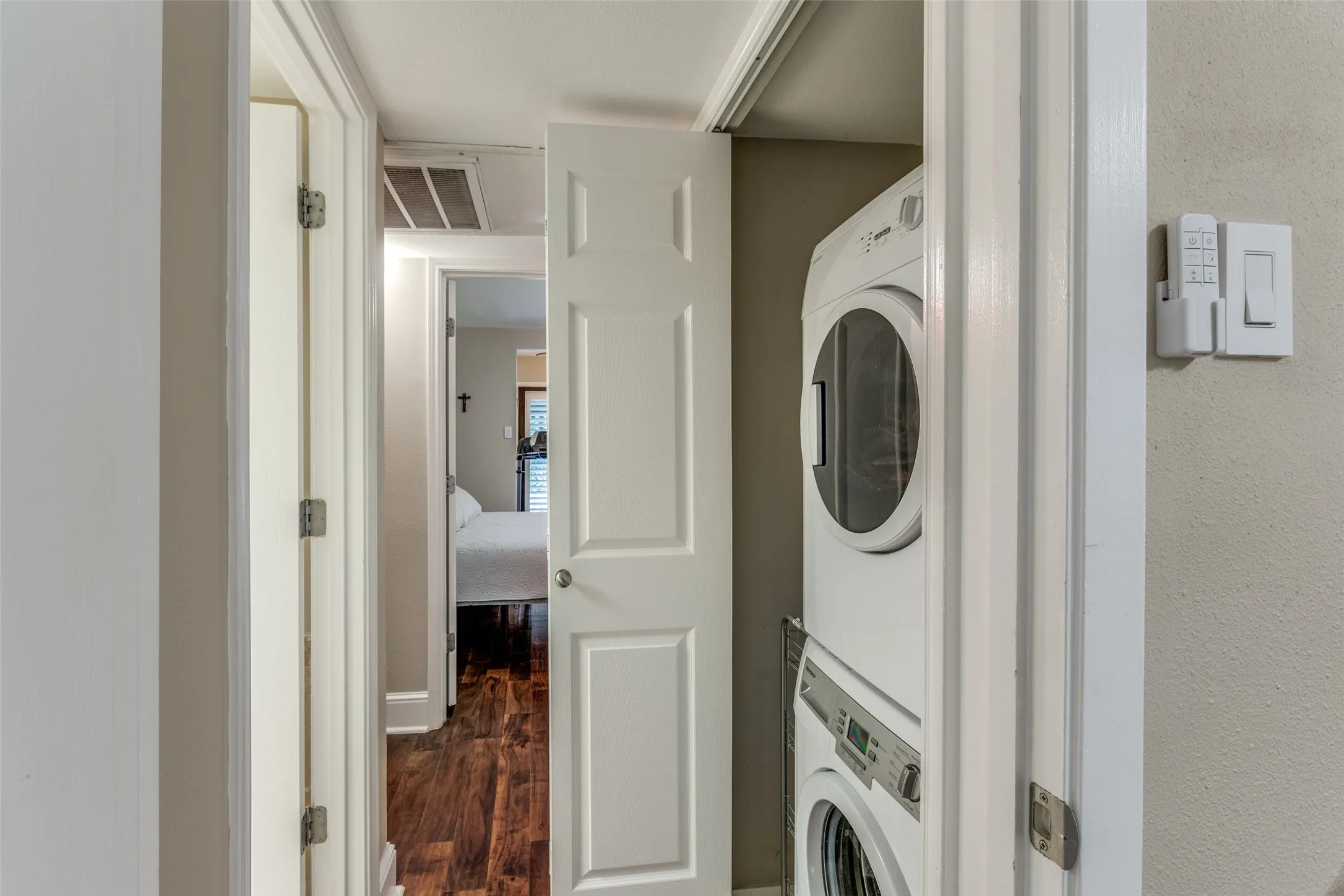 In unit stacked washer and dryer area.
