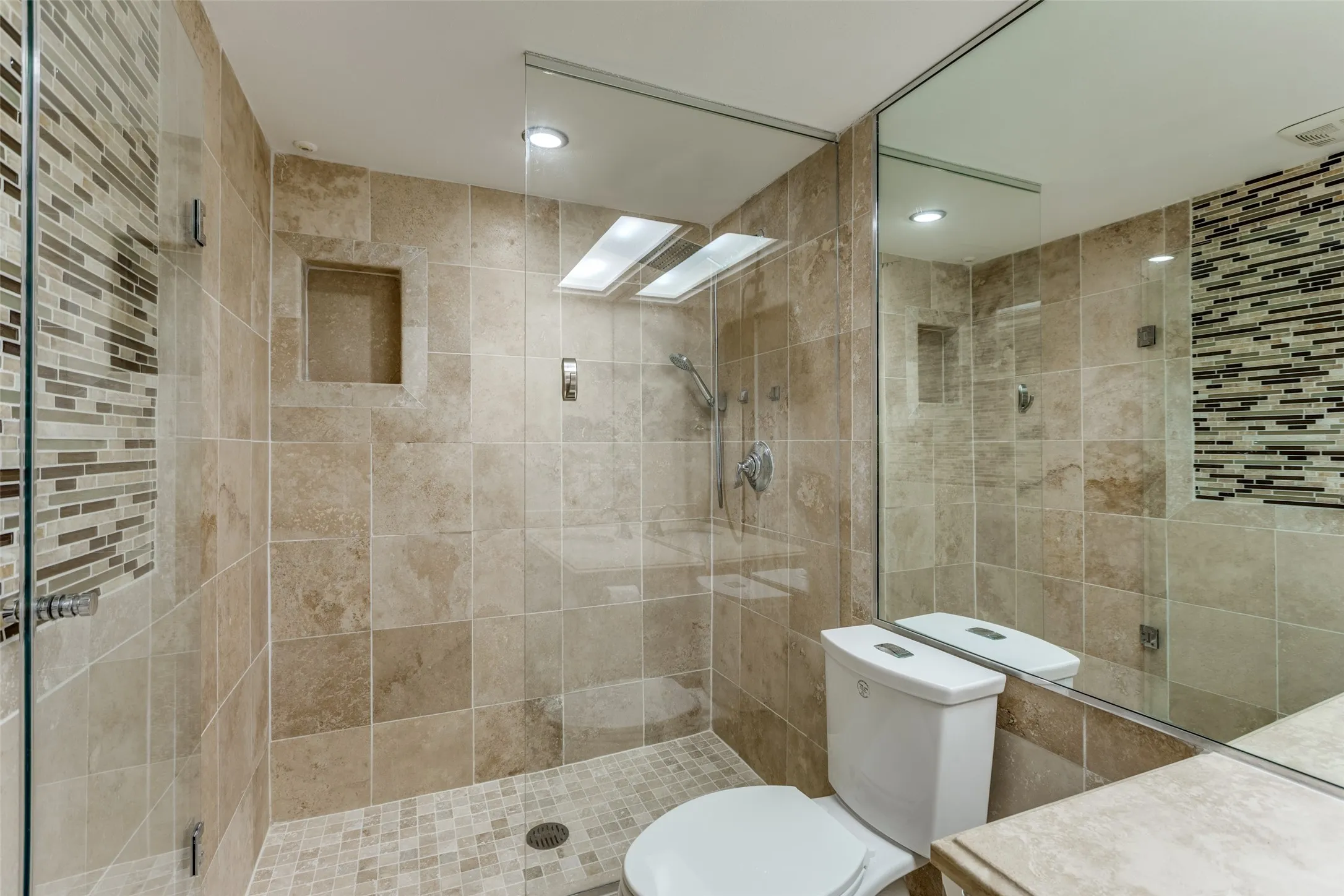 Bathroom with radiator, tile walls, an enclosed shower, and toilet