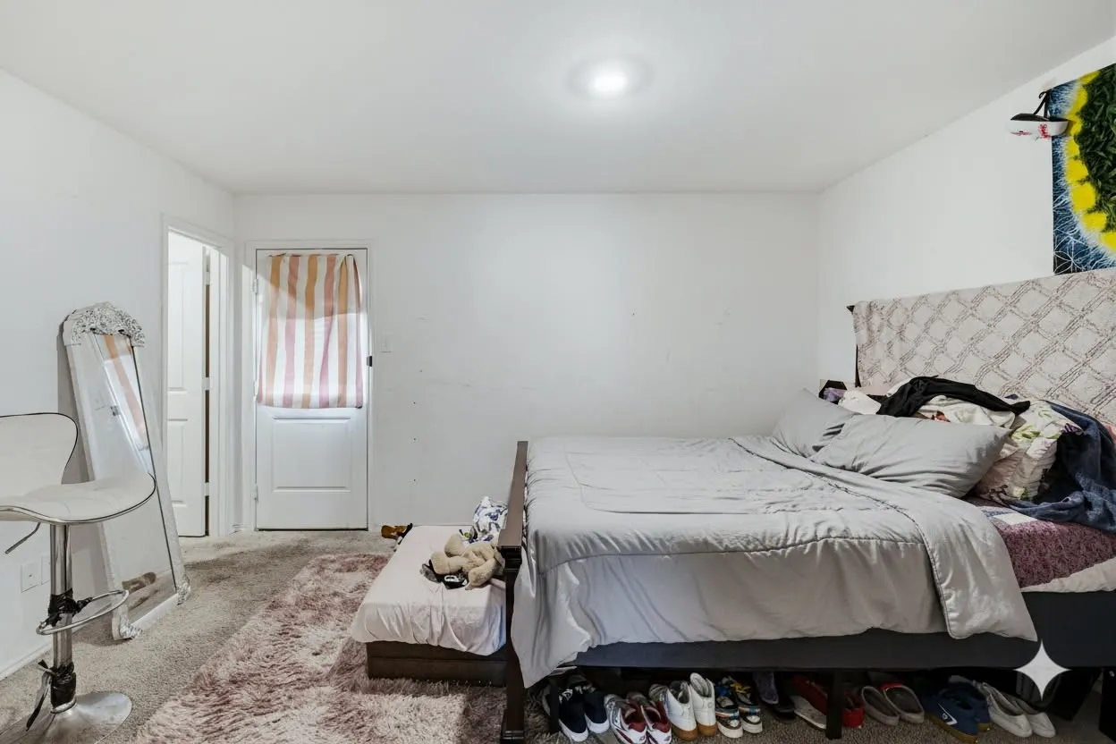 The room features carpeted flooring and white walls, offering a versatile space.  Virtually Staged