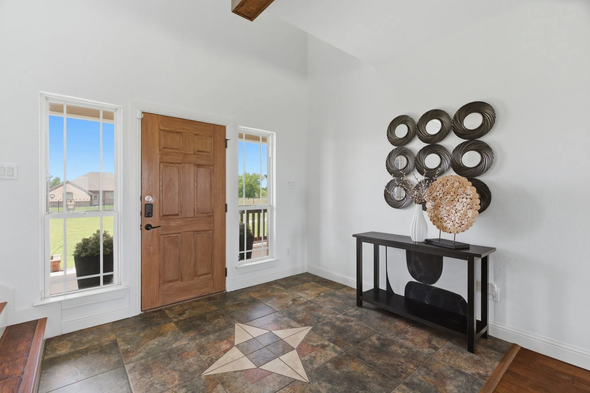 A light-filled entry welcomes you into 250 Newfield Ln with warm wood flooring, natural light and an easy connection to the main living spaces.