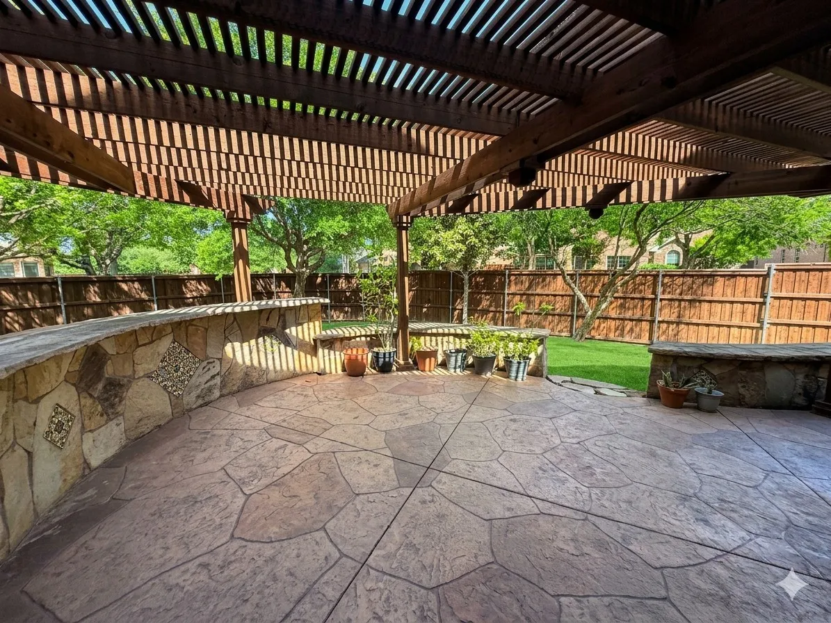 Expansive stamped concrete patio featuring a wood pergola and stone-faced built-in bar