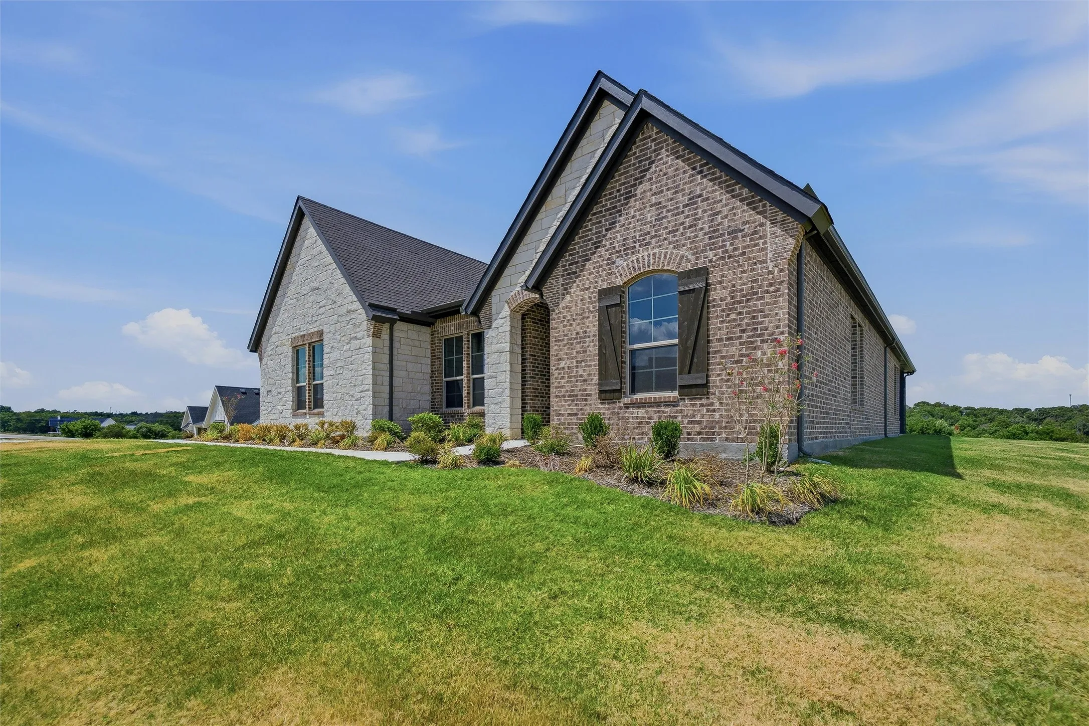 Brick and stone exterior with dark trim
