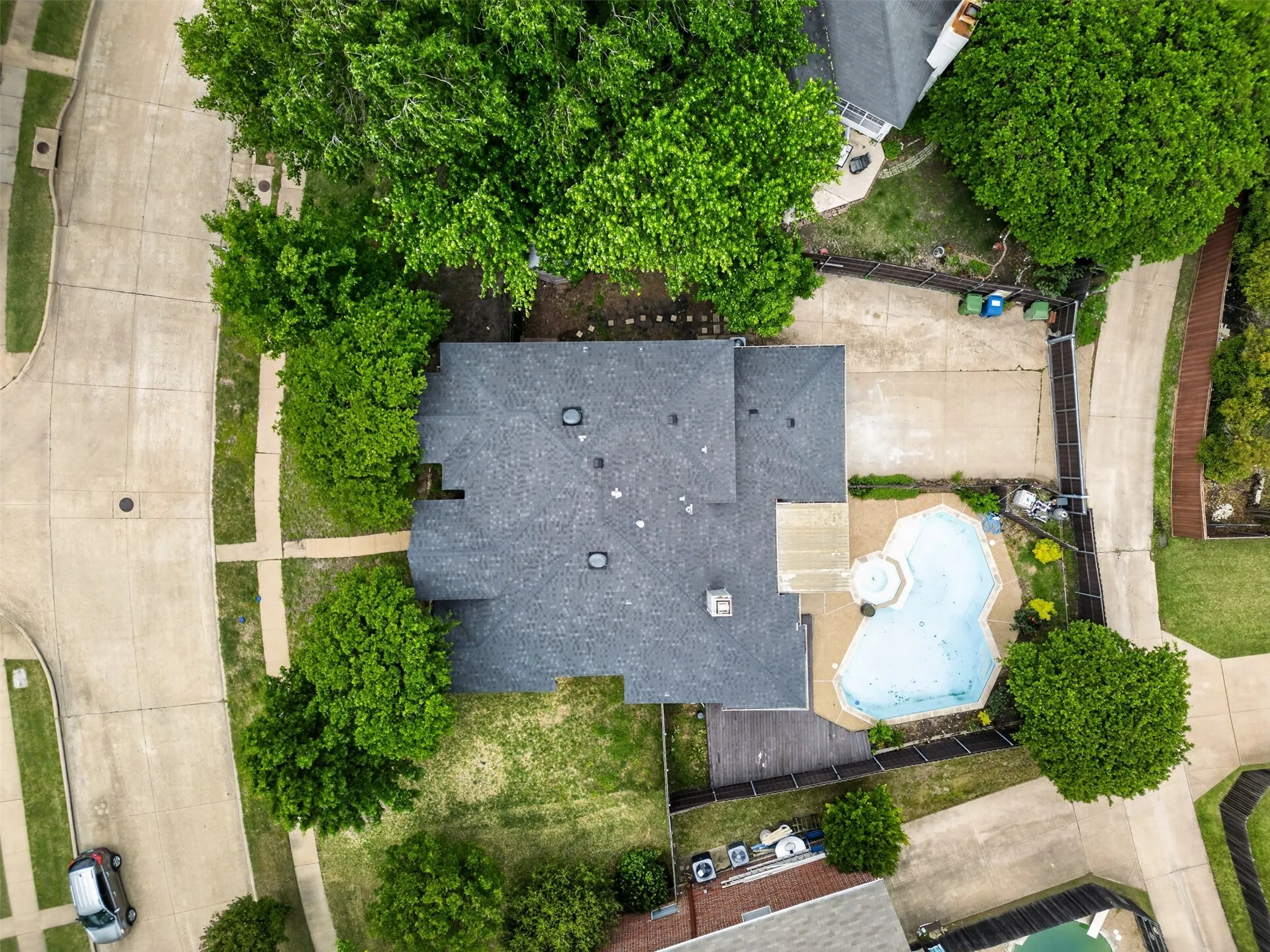 The property features a private swimming pool with a paved surround