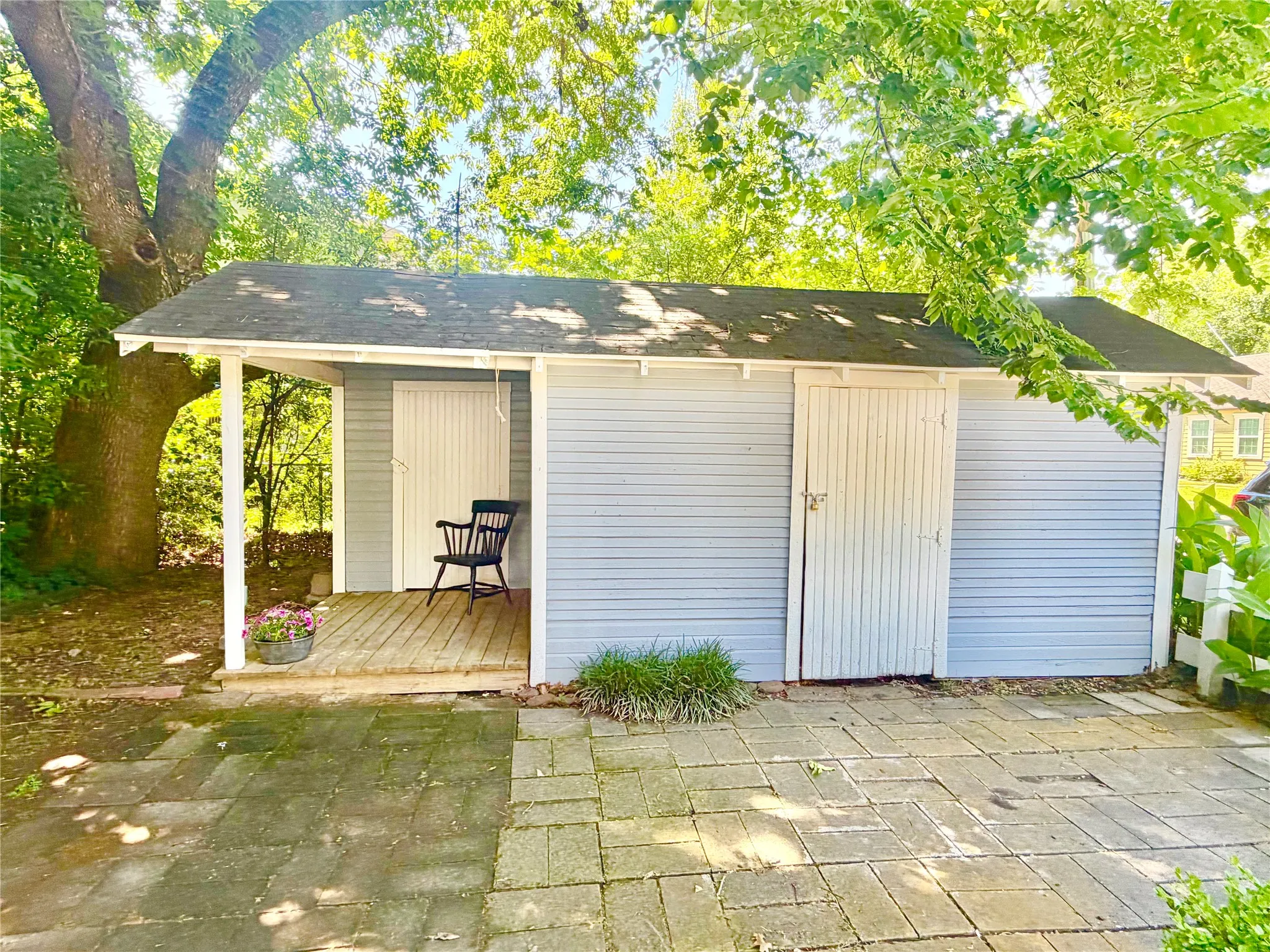 VINTAGE STORAGE BUILDING WITH PORCH FROM GENTLER ERA..