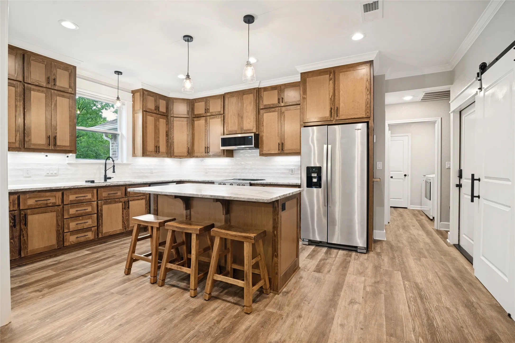 A beautifully designed kitchen that is perfect for this one-of-a-kind custom home. Refrigerator is negotiable with your offer.