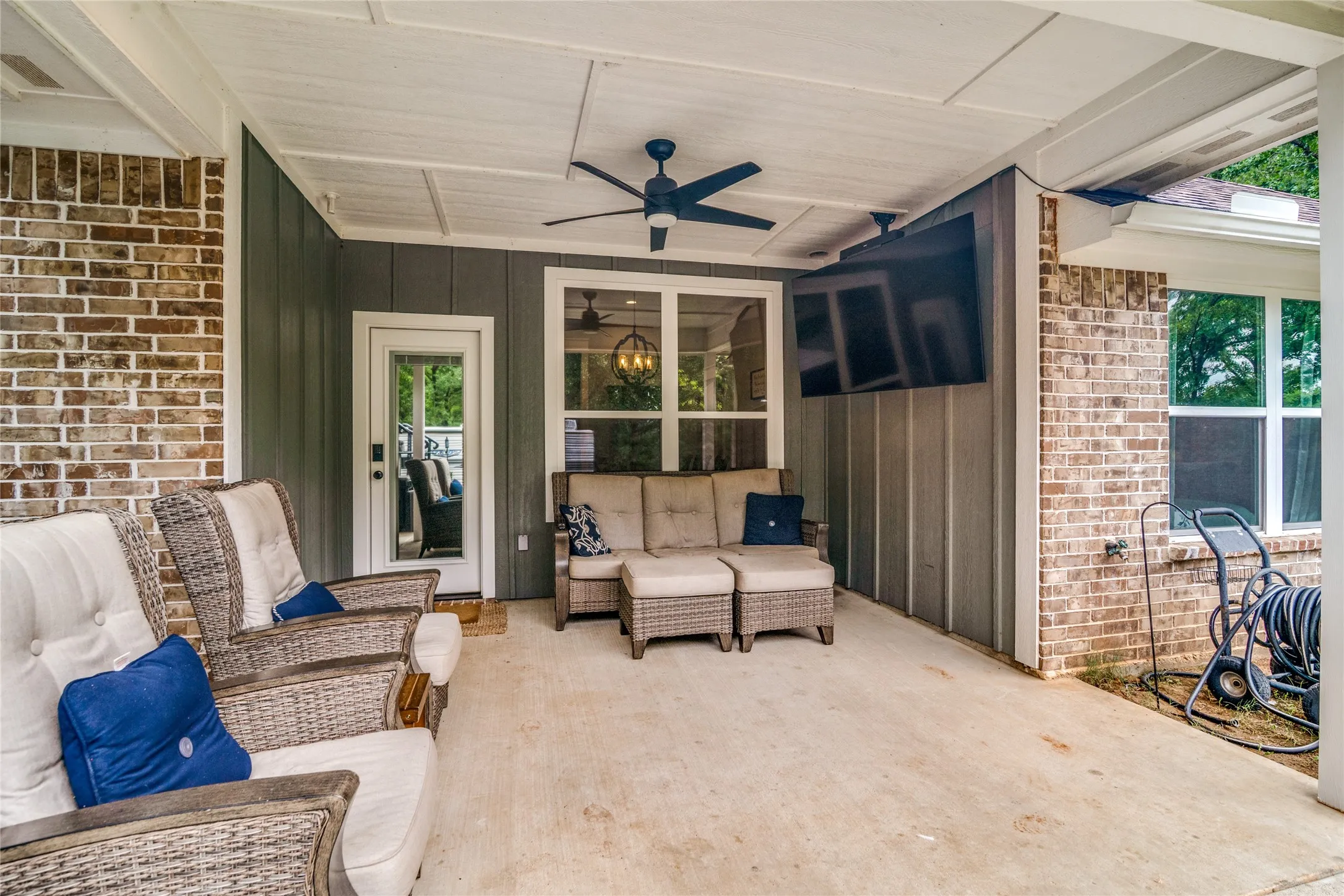 Rear covered patio. This TV and the Patio furniture are also negotiable with your offer.