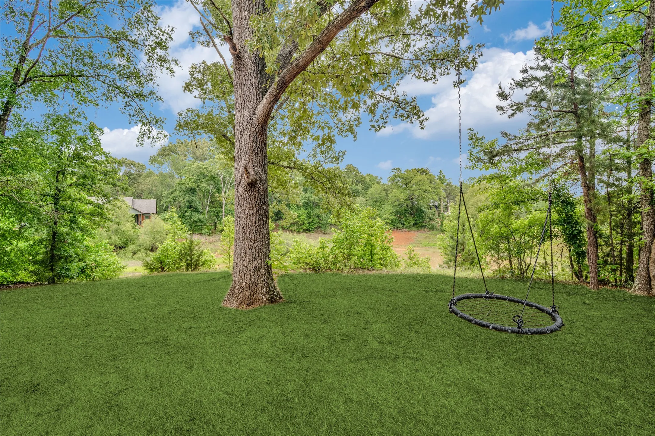 The swing stays so that you may enjoy it for many years into the future. Check out the pond just behind it.