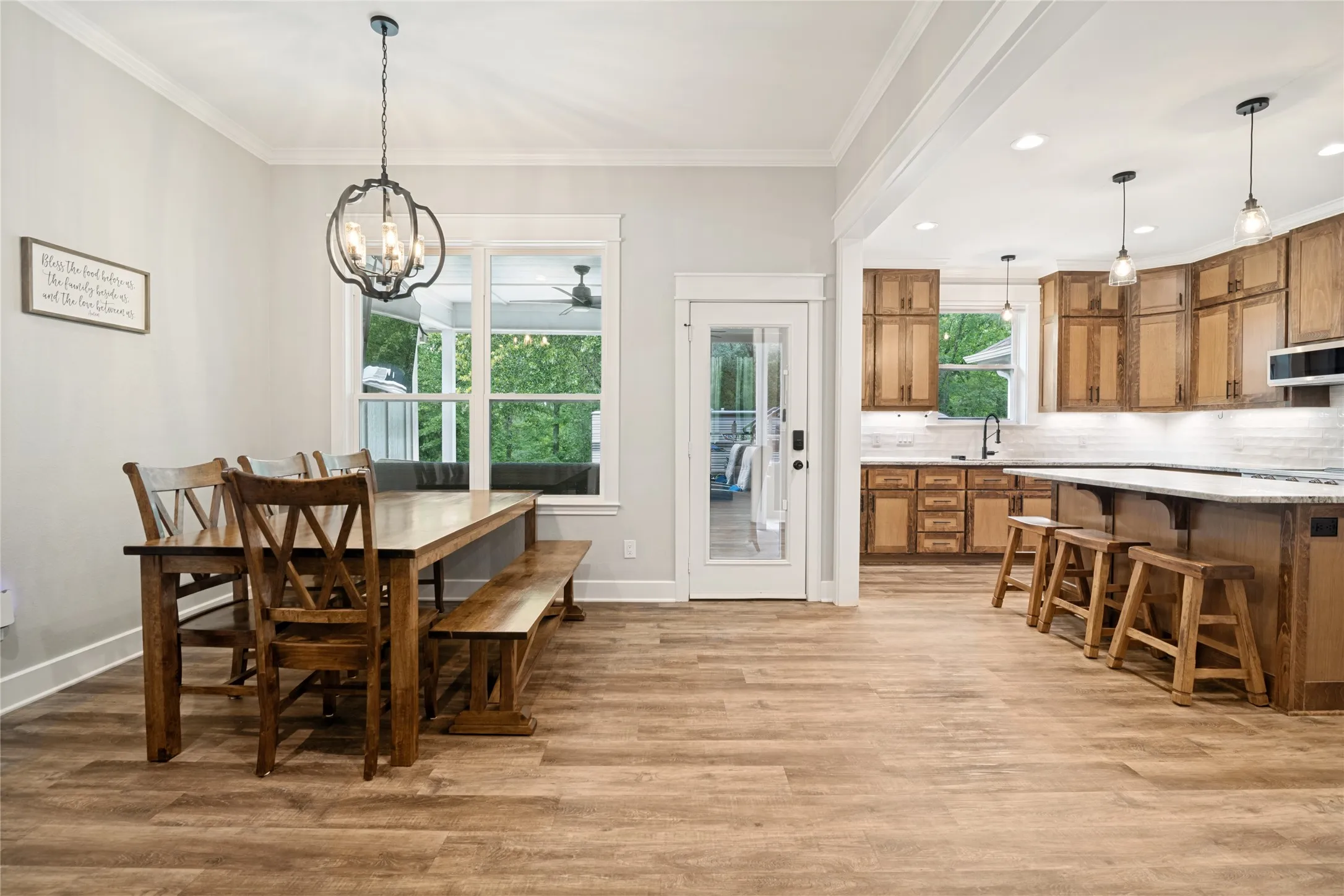 View of the dining space as it correlates with the kitchen and back coverd patio.