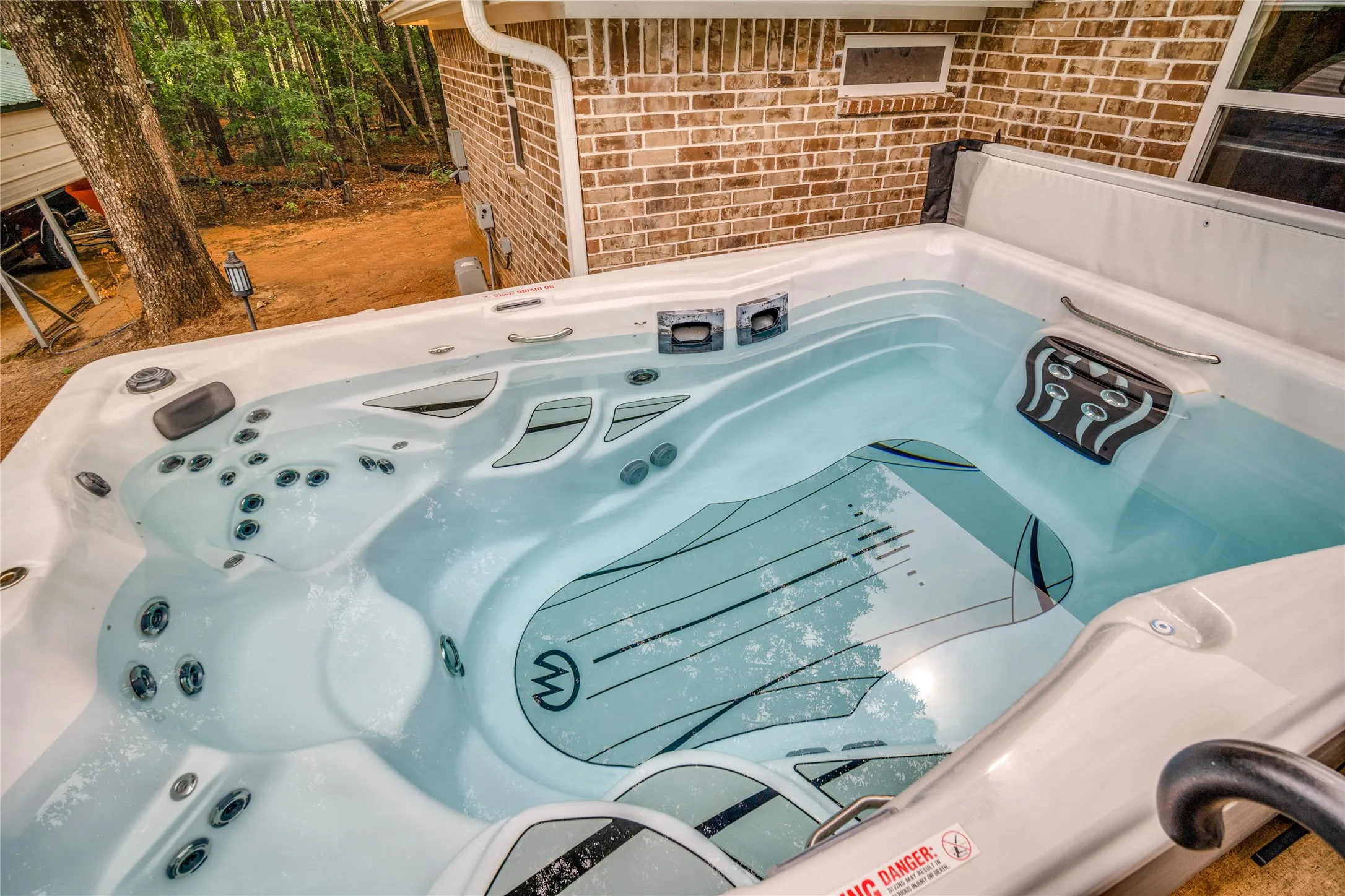 The Michael Phelps Signature Swim Spa conveys with the proeprty. There is also a designated 50amp outlet put place just for the swim spa.