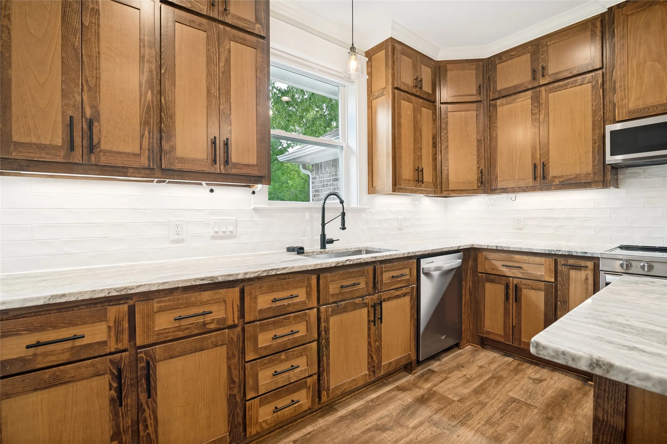Enjoy the view of the spacious back yard while standing at the sink!