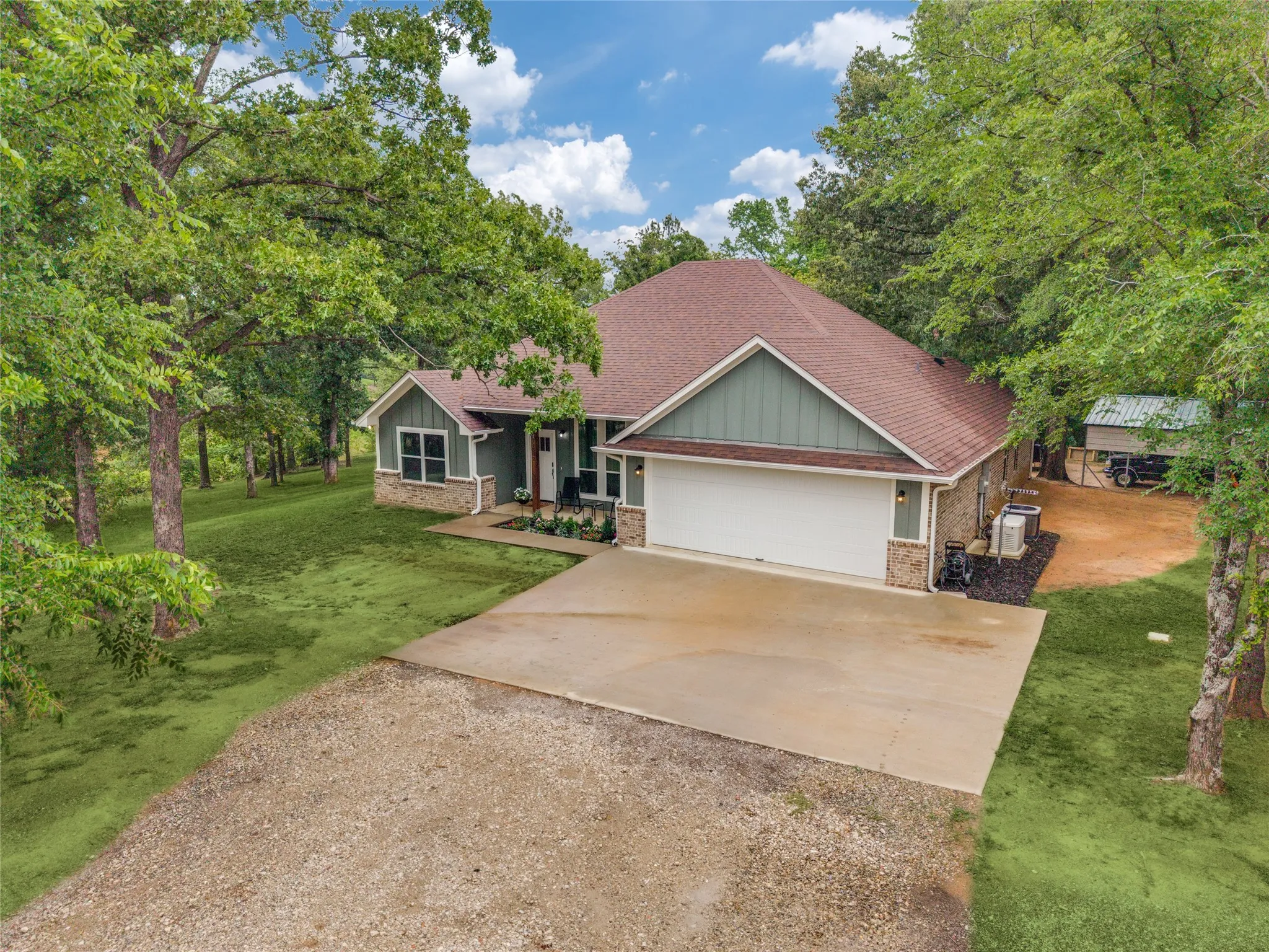 Aerial View front of home. Notice the carport in the back of the property, as well as the Generac on the right side of the home.