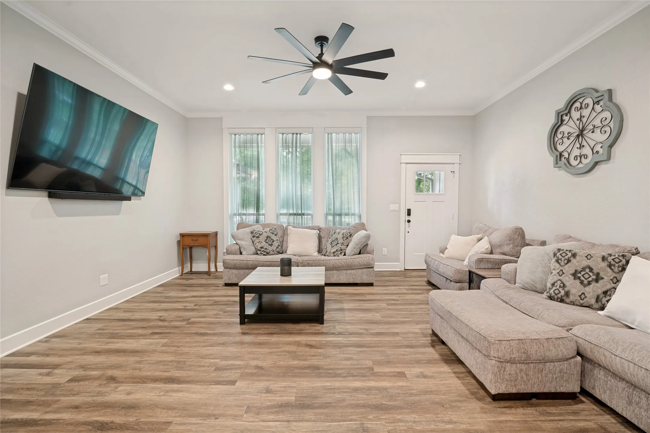 Living room. The door you are looking at goes to the front patio. All TVs are negotiable with your offer.