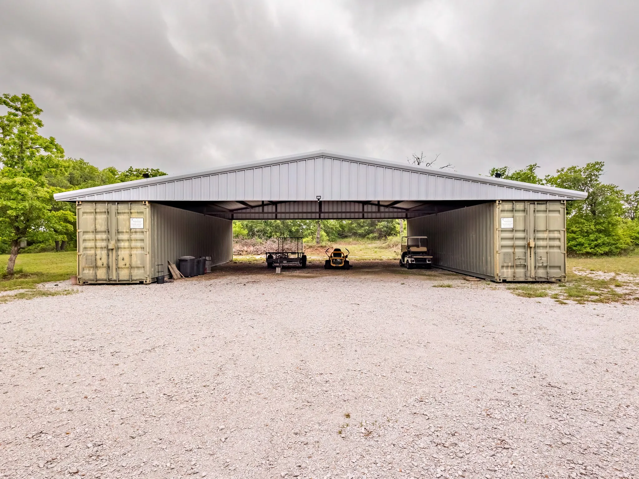 Oversized carport for tractor, ATV and cars plus sea containers for your hunting equipment, ETC.