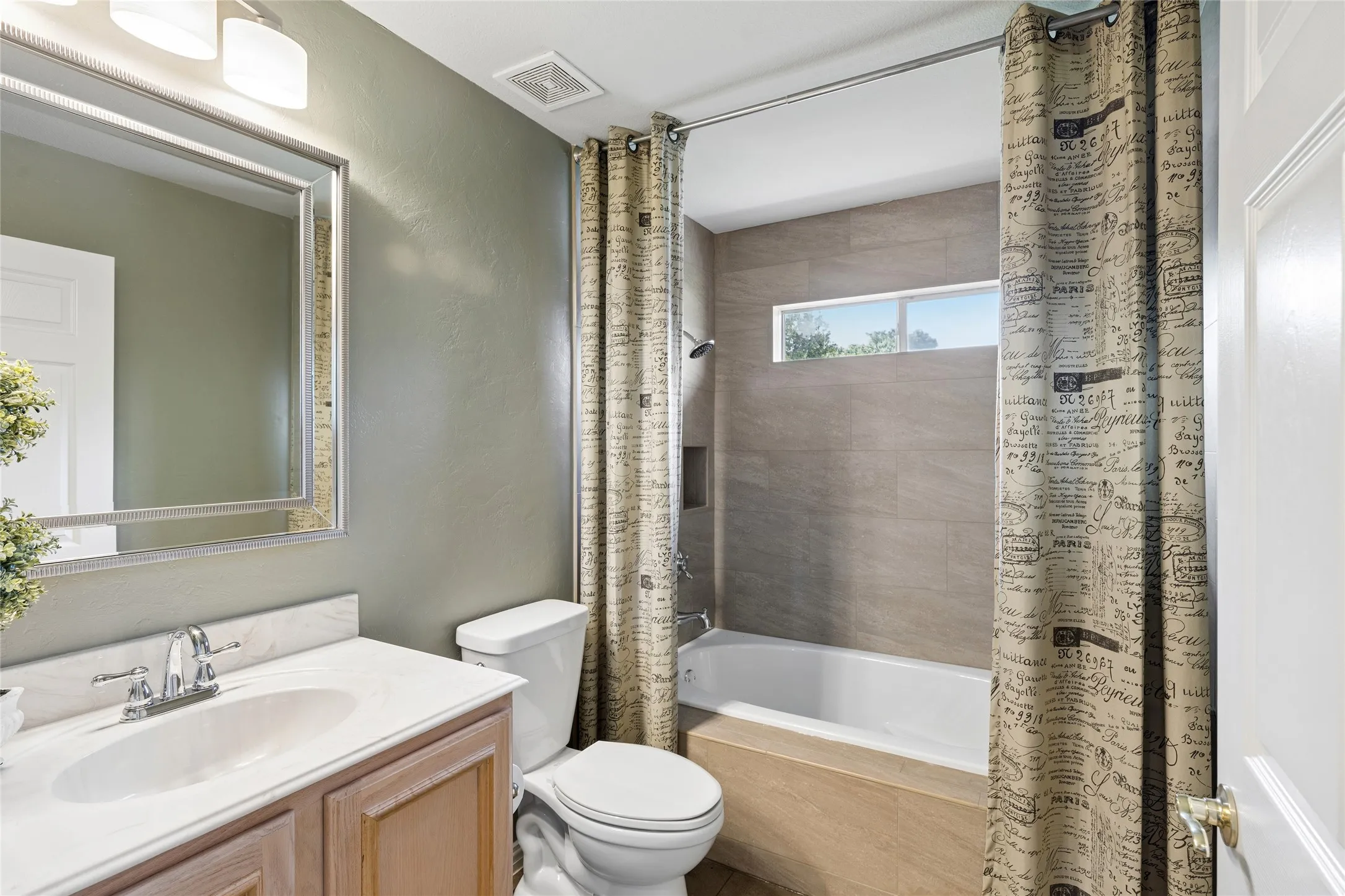 Full bath featuring a deep soaking tub