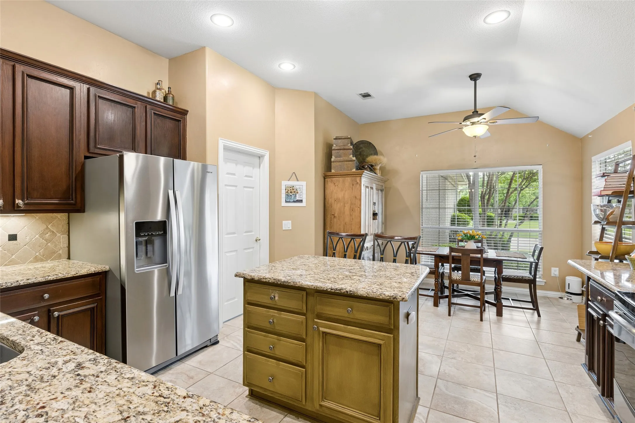 Open view of kitchen and breakfast/dining area