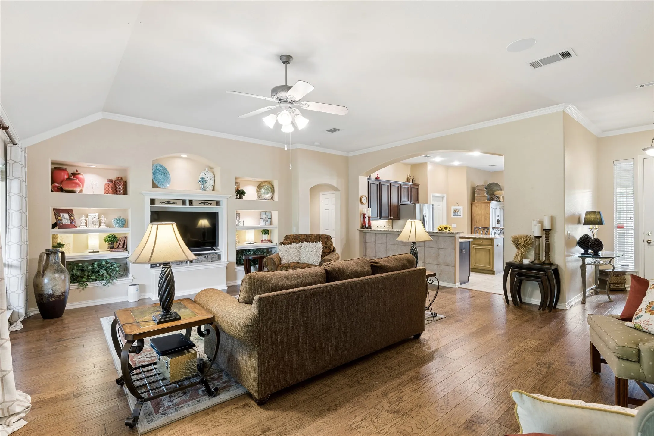 Living area featuring beautiful built-ins and hardwood floors